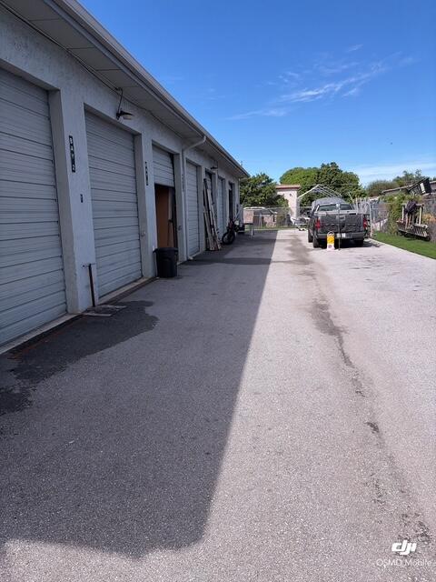 New Wave Fabrications, 625 Industrial Ave, Boynton Beach: overhead doors along the drive